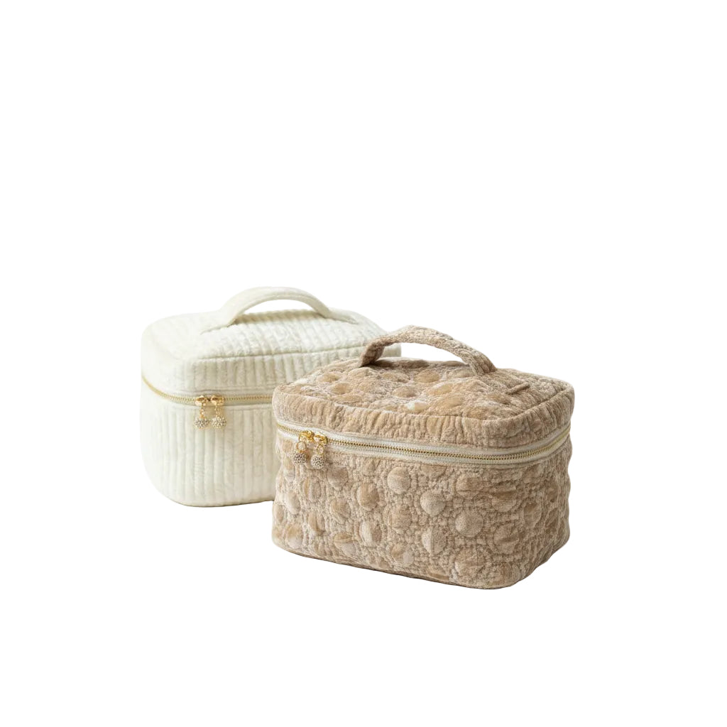 Two decorative jewelry boxes on a marble surface