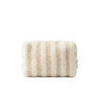 Beige textured pouch with a gold zipper on a dark surface