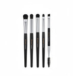 Set of makeup brushes with black handles and silver ferrules, next to their packaging.