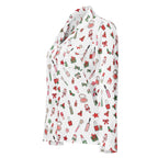 A white long-sleeve collared shirt with a festive Christmas-themed print featuring red lipsticks, green candy canes, red bows, and gift boxes, shown on a plain white background.