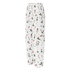 White wide-leg lounge pants featuring a festive Christmas print with candy canes, holly, ornaments, and red bows.