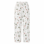 White drawstring lounge pants with an all-over Christmas-themed print featuring red bows, green holly, candy canes, and red lipstick tubes.