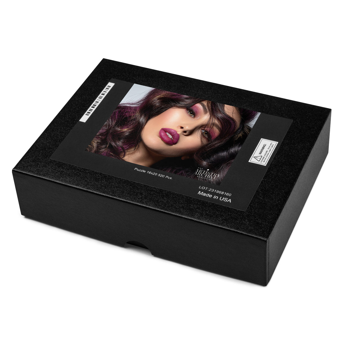 A black rectangular wig box with a glossy front label showing a model with dark purple hair and magenta lipstick, photographed on a white background.