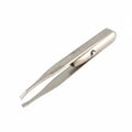 Eyebrow tweezer with close-up inset showing use on a white background