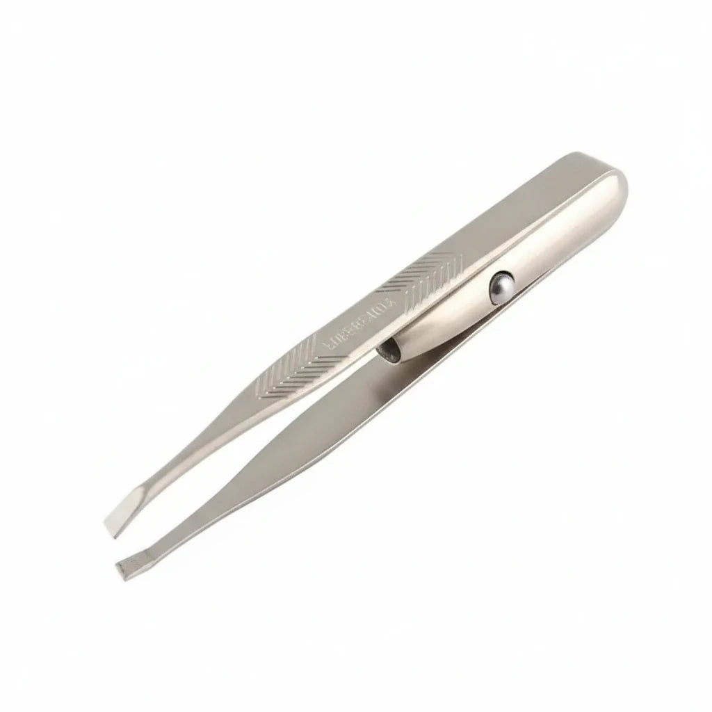 Eyebrow tweezer with close-up inset showing use on a white background