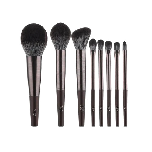 Set of makeup brushes with measurements on a white background