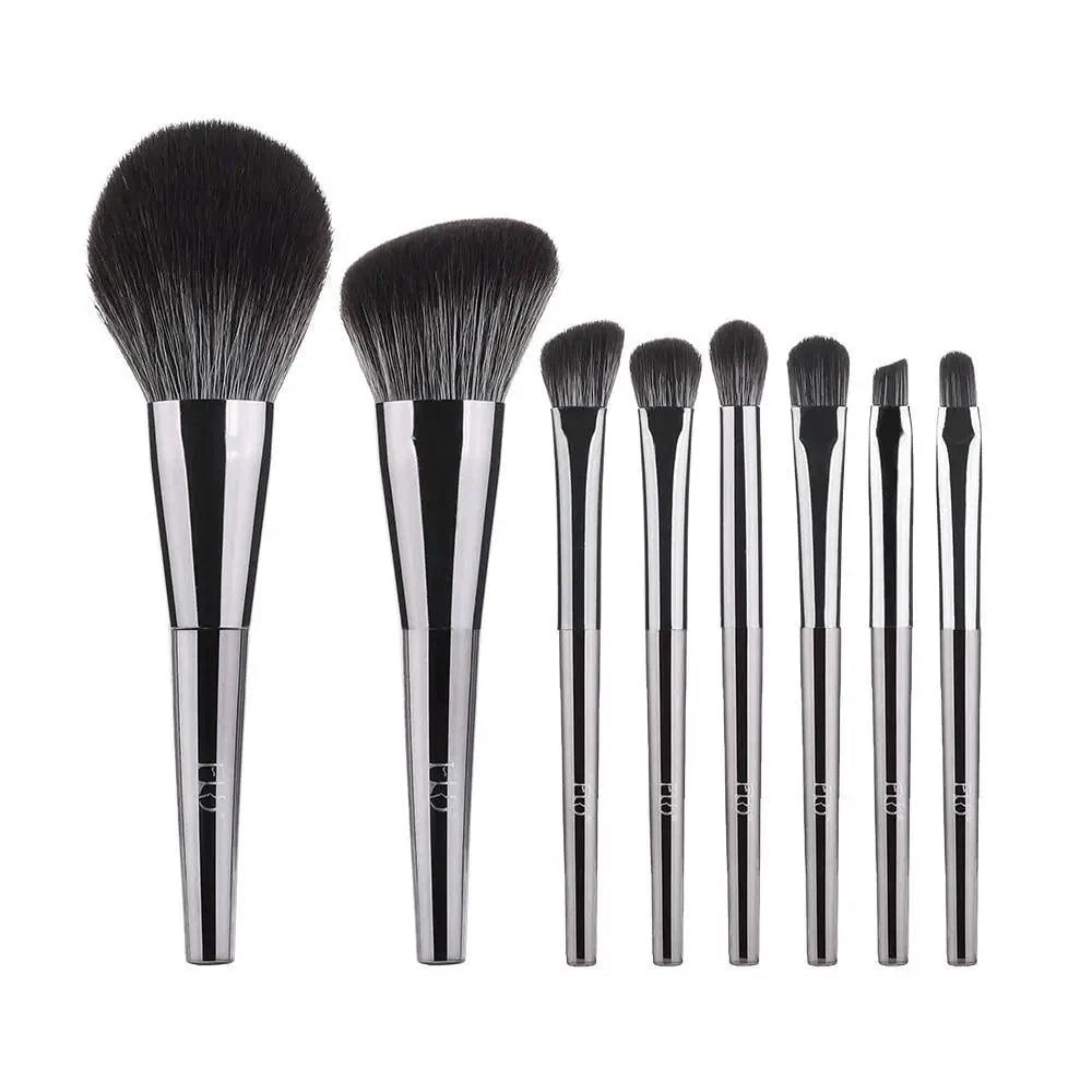 Set of makeup brushes with black bristles and silver handles on a white background