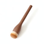 A makeup foundation brush with a medium brown wooden handle and soft bristles in beige and white, shown on a light gray background with an inset close-up of the brush head and text listing dimensions.